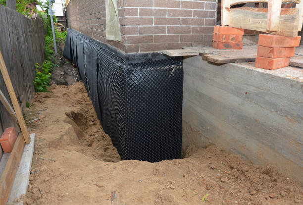 Happy homeowners after waterproofing job in Flint Hill